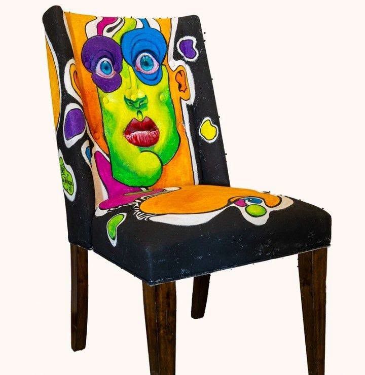 Painted chair from the Puzzle series with a colorful face on the backrest