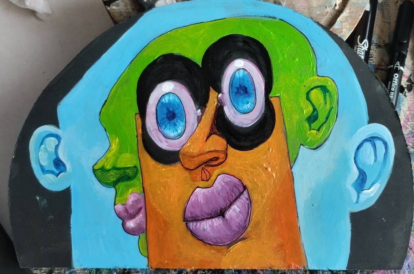Half-moon Puzzle piece: two overlapping faces in blue, green and orange with purple lips